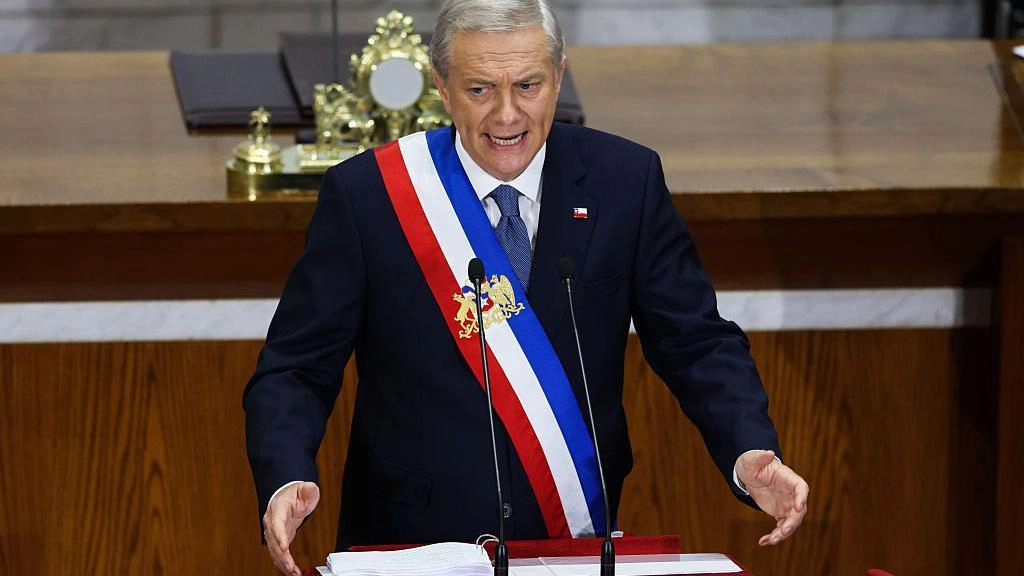 What advantages and risks does Kasts controversial plan to reduce the corporate tax in Chile have