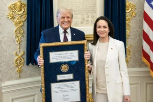 Trump shows off the Nobel Peace Prize medal given to him by Maria Corina Machado