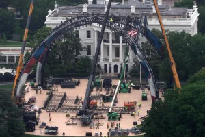 The setting up of the stage to carry out a UFC event in a garden of the White House began