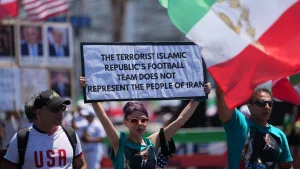 Iranians defend their flag in protest outside SoFi Stadium