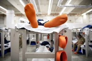 Court orders improvements at an immigration detention center where four people have died
