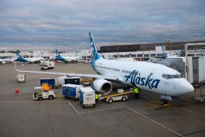 An Alaska Airlines flight was detained in Miami after passengers threatened to take control of the plane